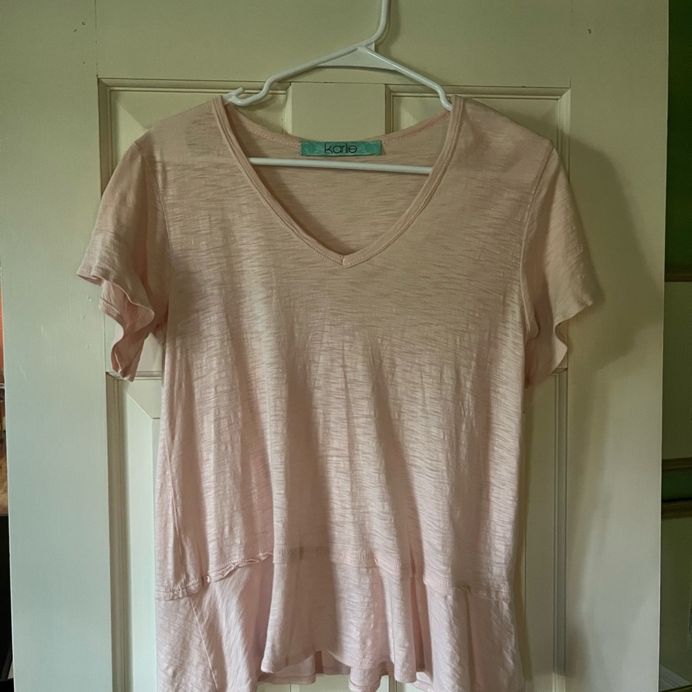 Karlie Women's Pink V-Neck Top with ruffle at the hem and sleeves.